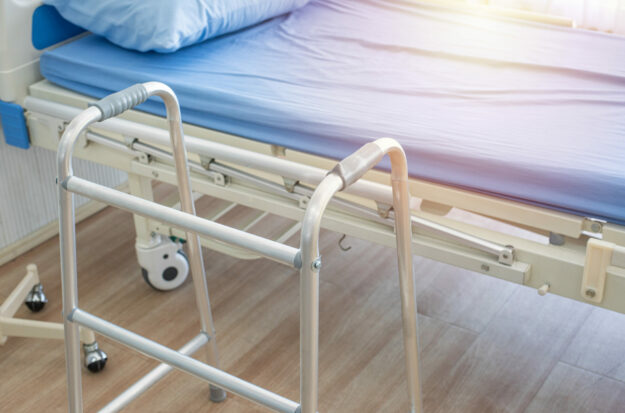 crutches,bed and mobility aids in ward of hospital.